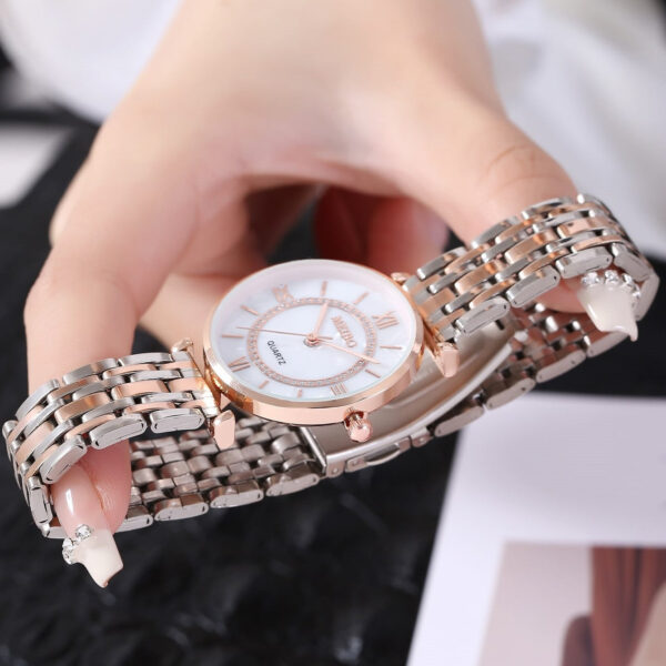 Eclat Newyork Women's Casual Watch with alloy steel strap, diamond-embedded design, and simple Roman numeral face.