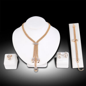 EclatNewyork 5pcs Rhinestone Jewelry Set including a sparkling necklace, bracelet, ring, and earrings displayed on a white mannequin stand. Perfect for formal events and special occasions.