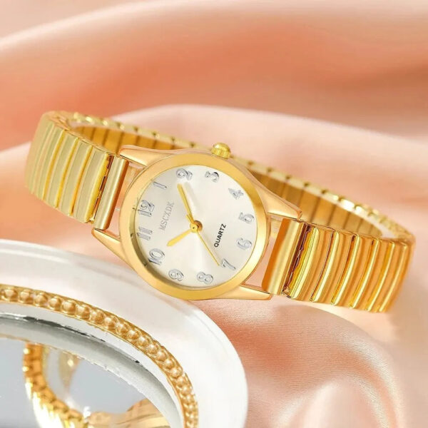 The Eclat Newyork's 6PCS Women's Gold Watch and Heart Jewellery Set comes with a bracelet, pendant necklace, earrings, ring, and gold-tone watch.