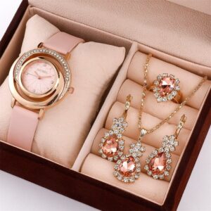 The stunning crystal-encrusted Eclat Newyork 5PCS Women's Watch with Pink Gemstones and Crystals Jewellery Set comes with a rose gold watch, pendant, earrings, and ring.