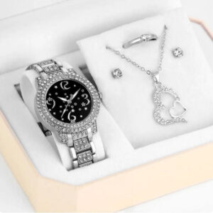 Eclat Newyork' 5-piece women's quartz watch and emerald pendant jewellery set is beautifully presented on a jewellery display.